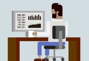 Man at Office desk with Monitor Graphs