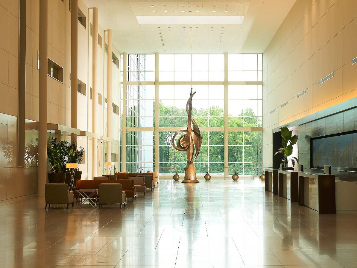 Lobby of Building C at Cary NC headquarters featuring original artwork, open spaces and natural lighting