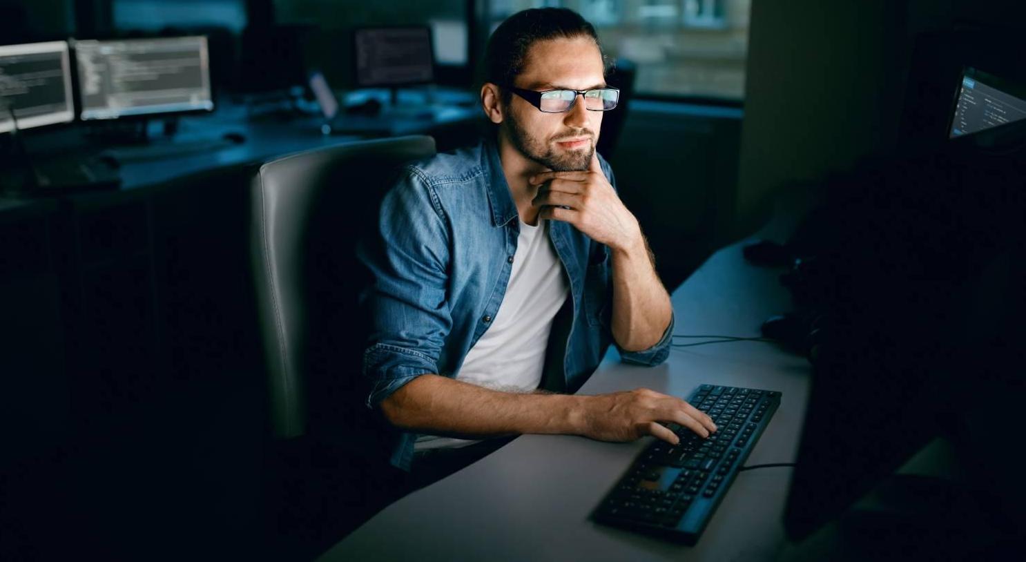 man looking at computer screen