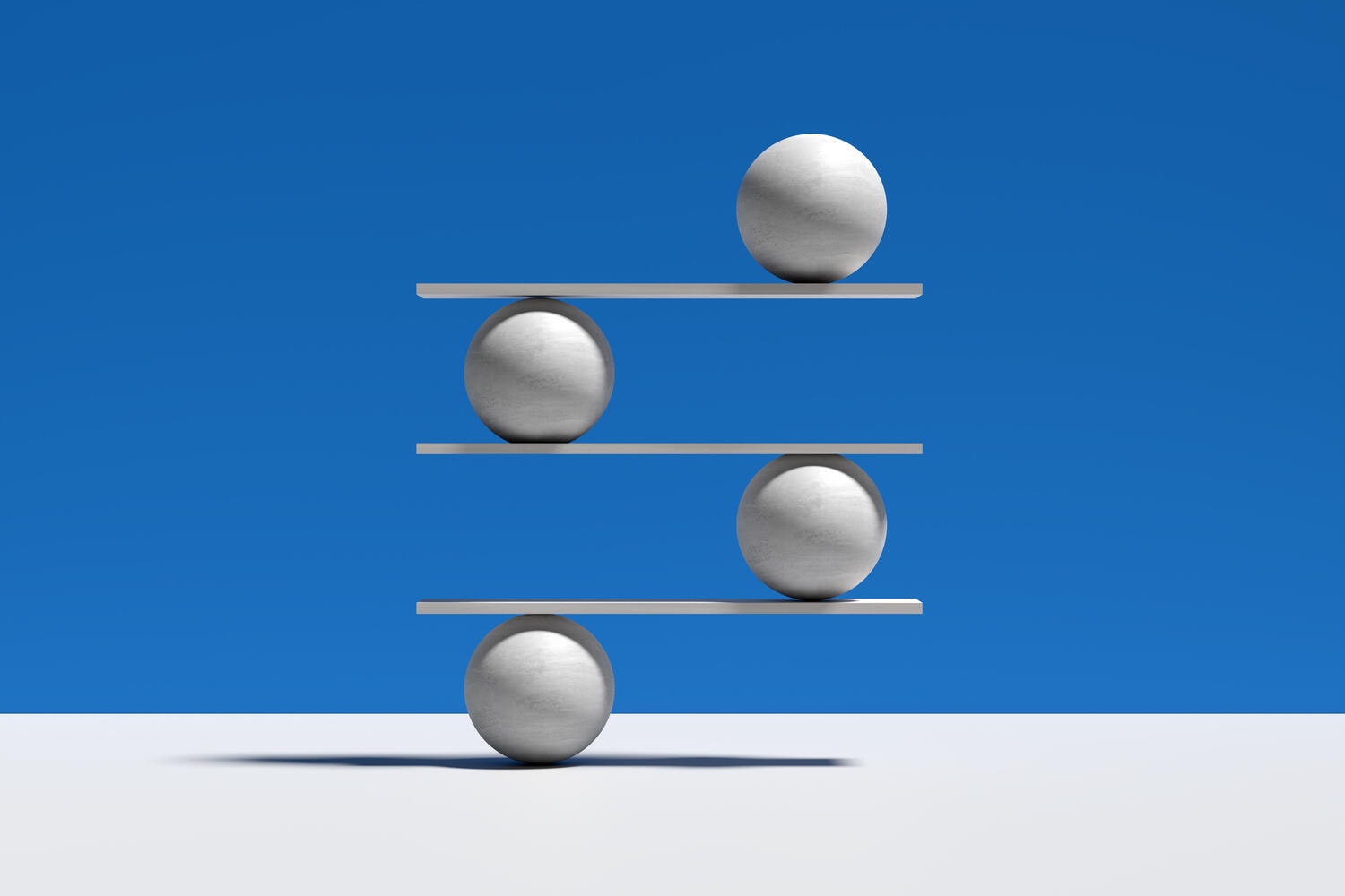 Spheres balancing on a seesaw