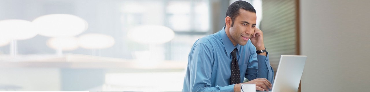 Man looking at data on his laptop