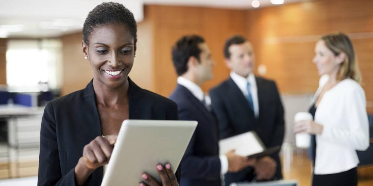 African American woman with tablet in office setting