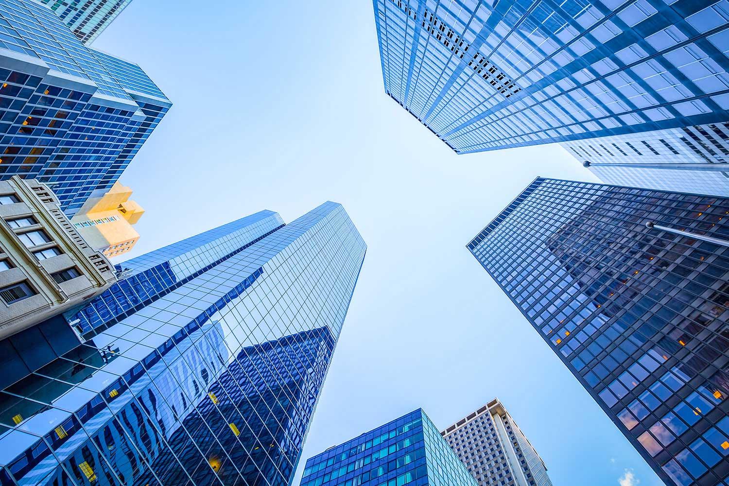 Looking up toward sky and skyscrapers in big city