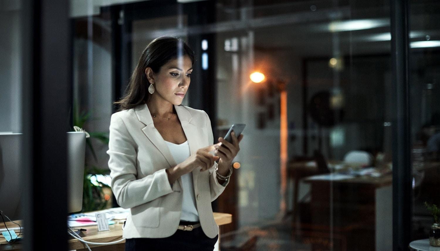 Business Woman Looking at Her Smartphone