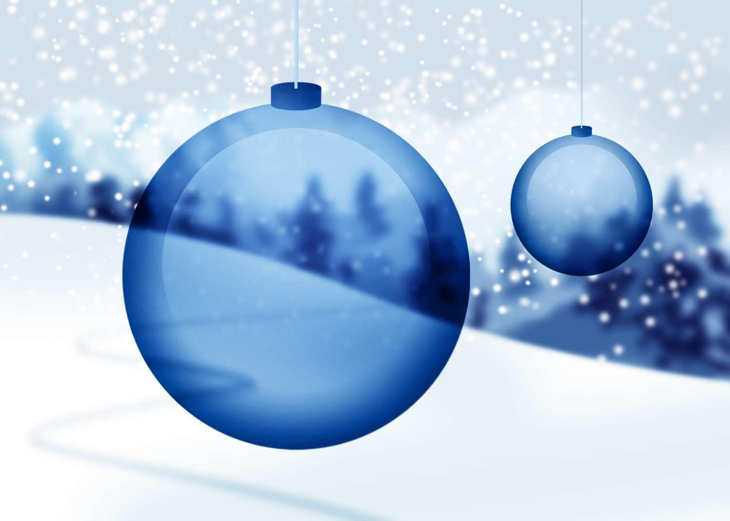 Transparent blue Christmas ornaments with snow