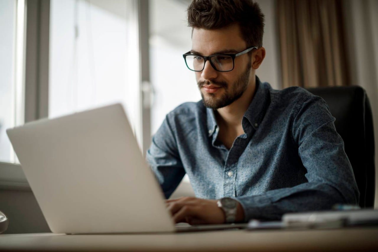 Young businessman working on laptop