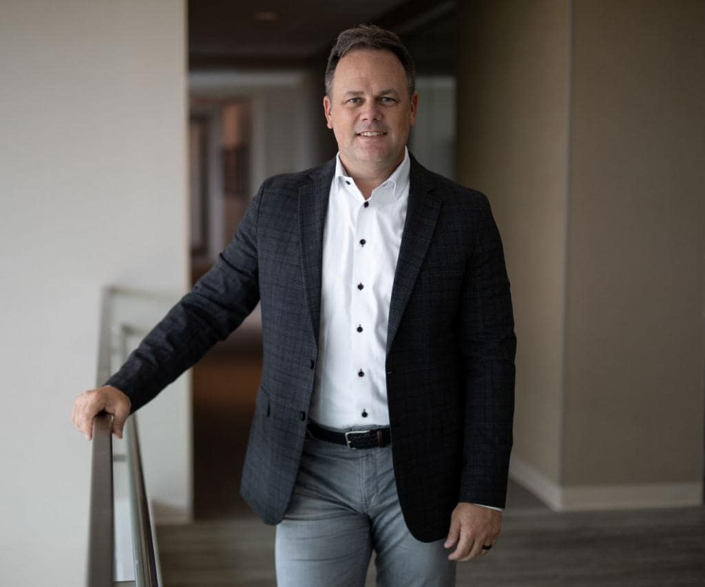Portrait of Bryan Harris standing by mezzanine
