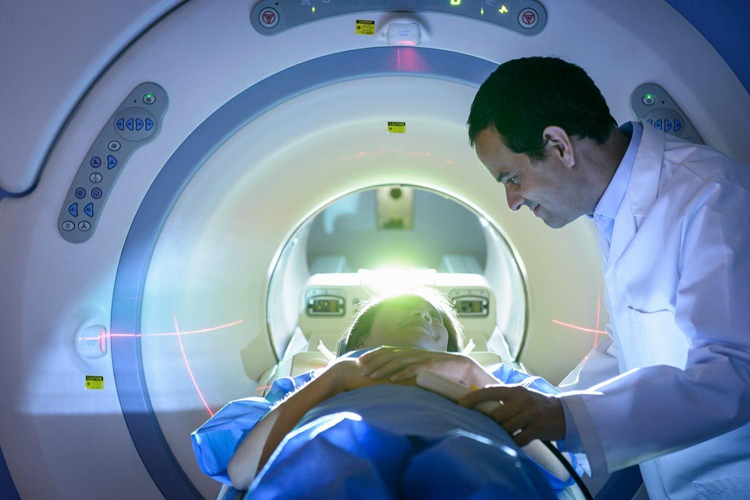 Doctor and patient using MRI machine