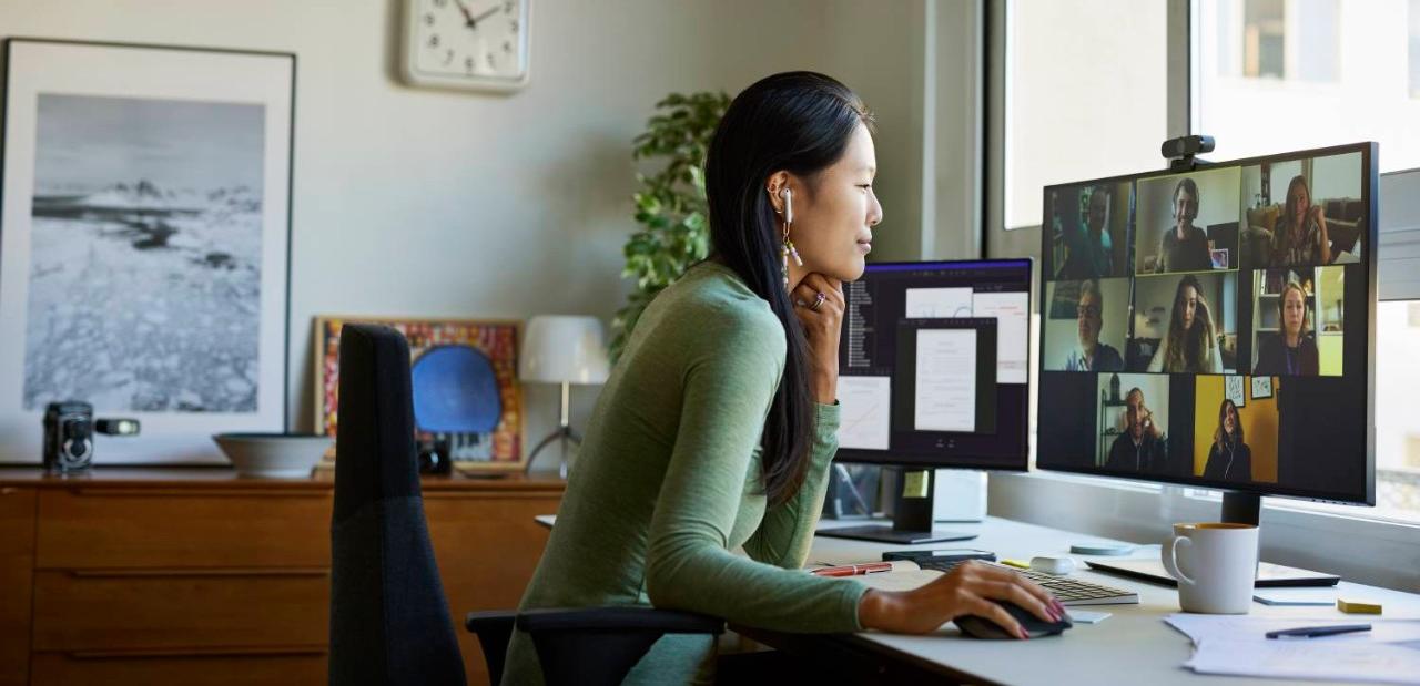 Woman using earbuds on video conference Woman using earbuds on video conference