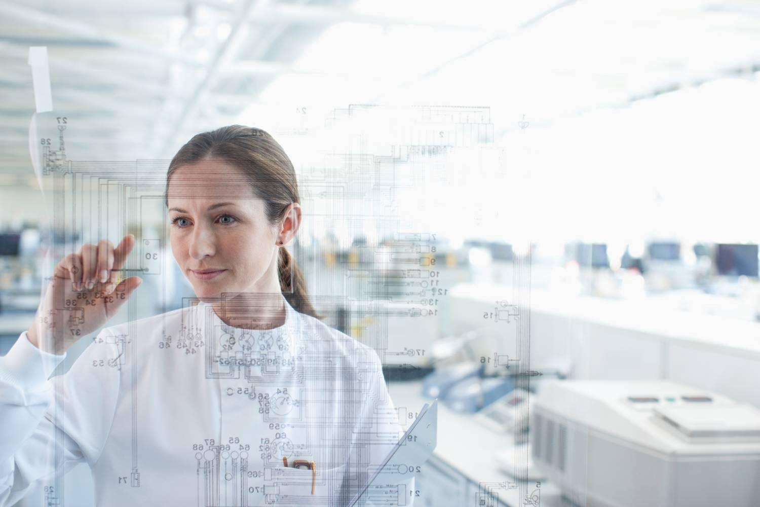Scientist using touch screen in lab Scientist using touch screen in lab