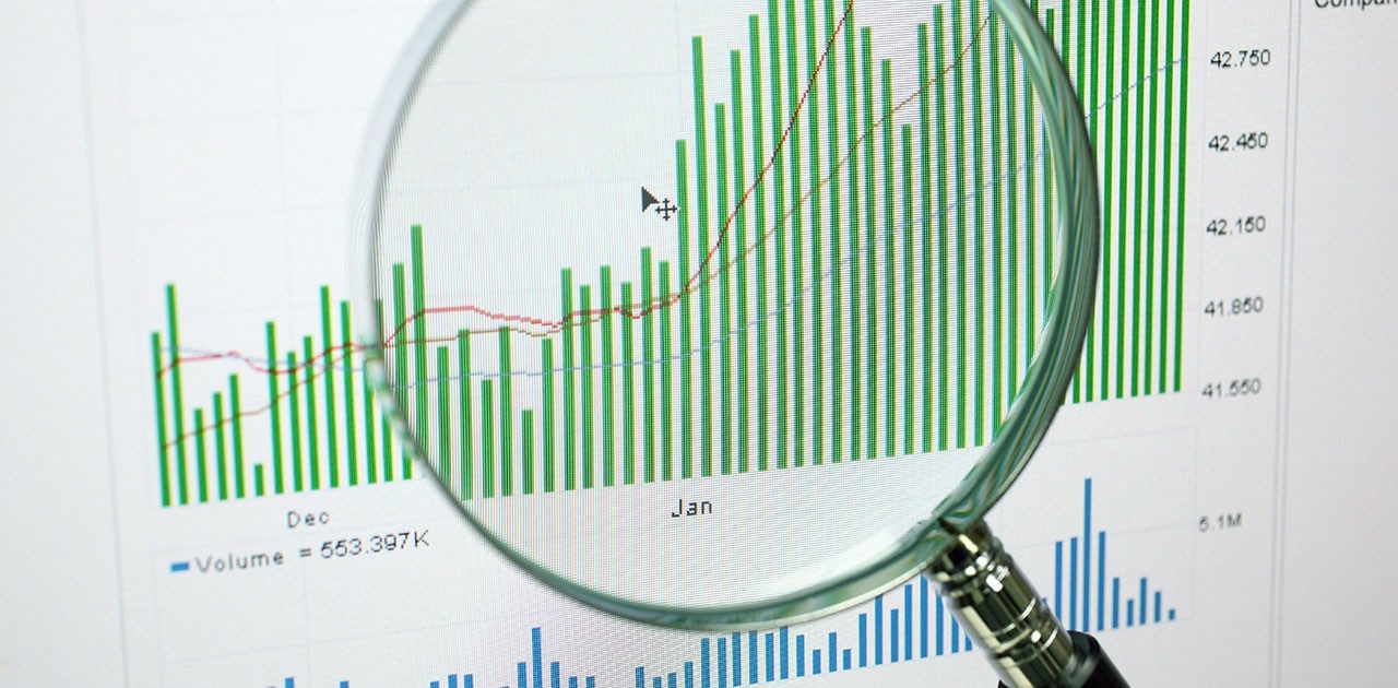 magnifying glass over data charts