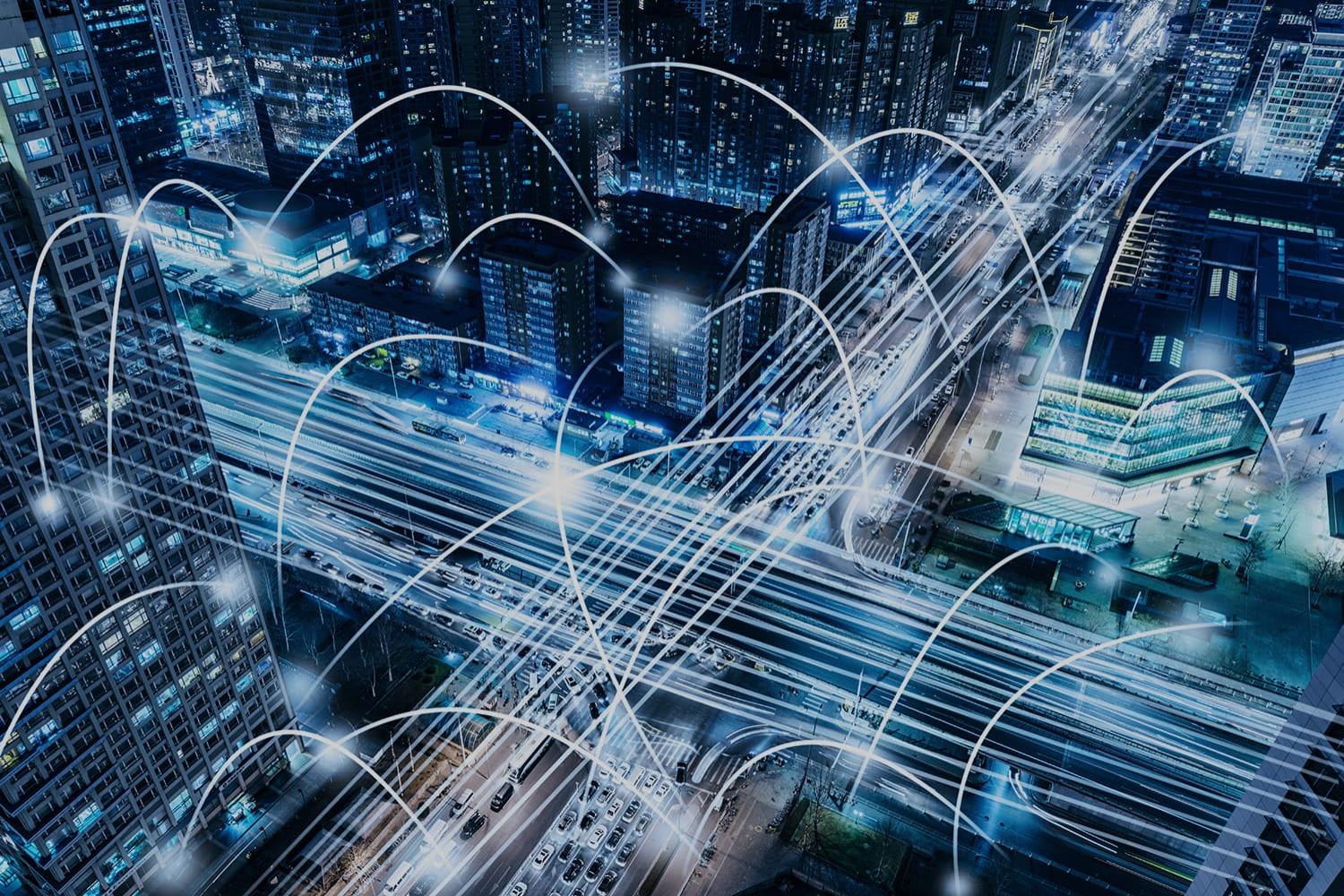 Cityscape at night with network connected data points Cityscape at night with network connected data points