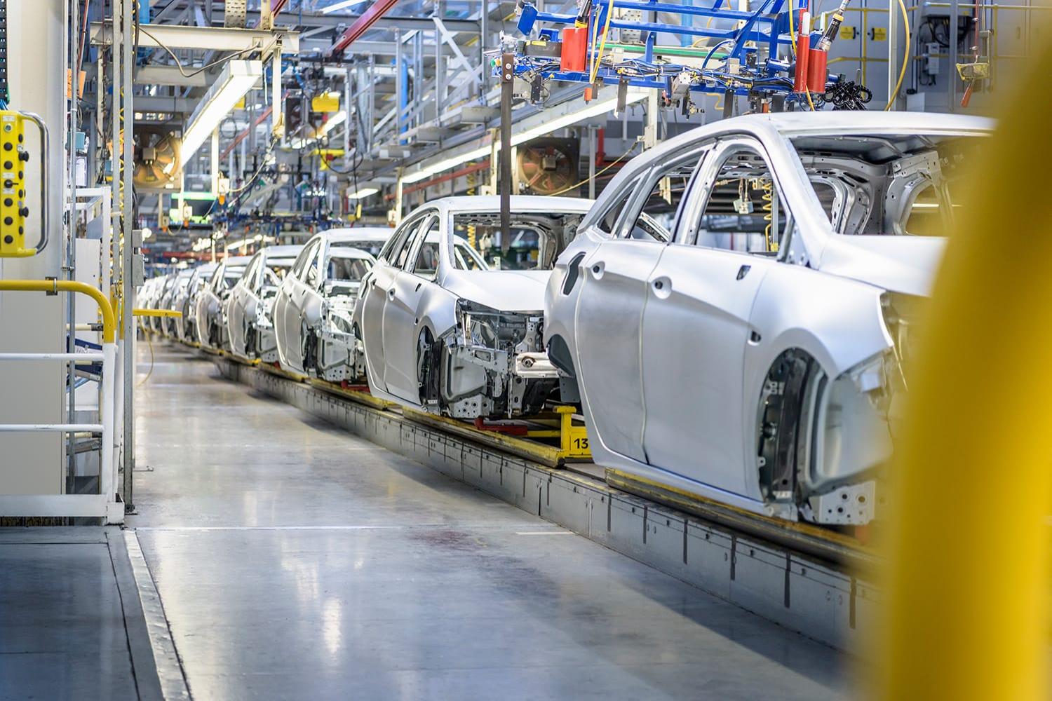 Row of cars in assembly line