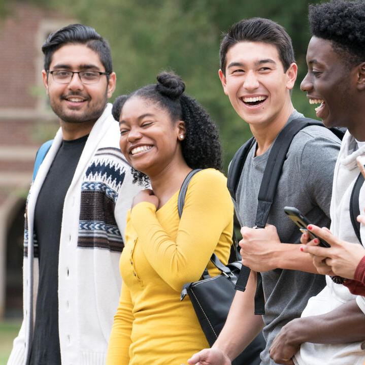 A group of college students walking on campus