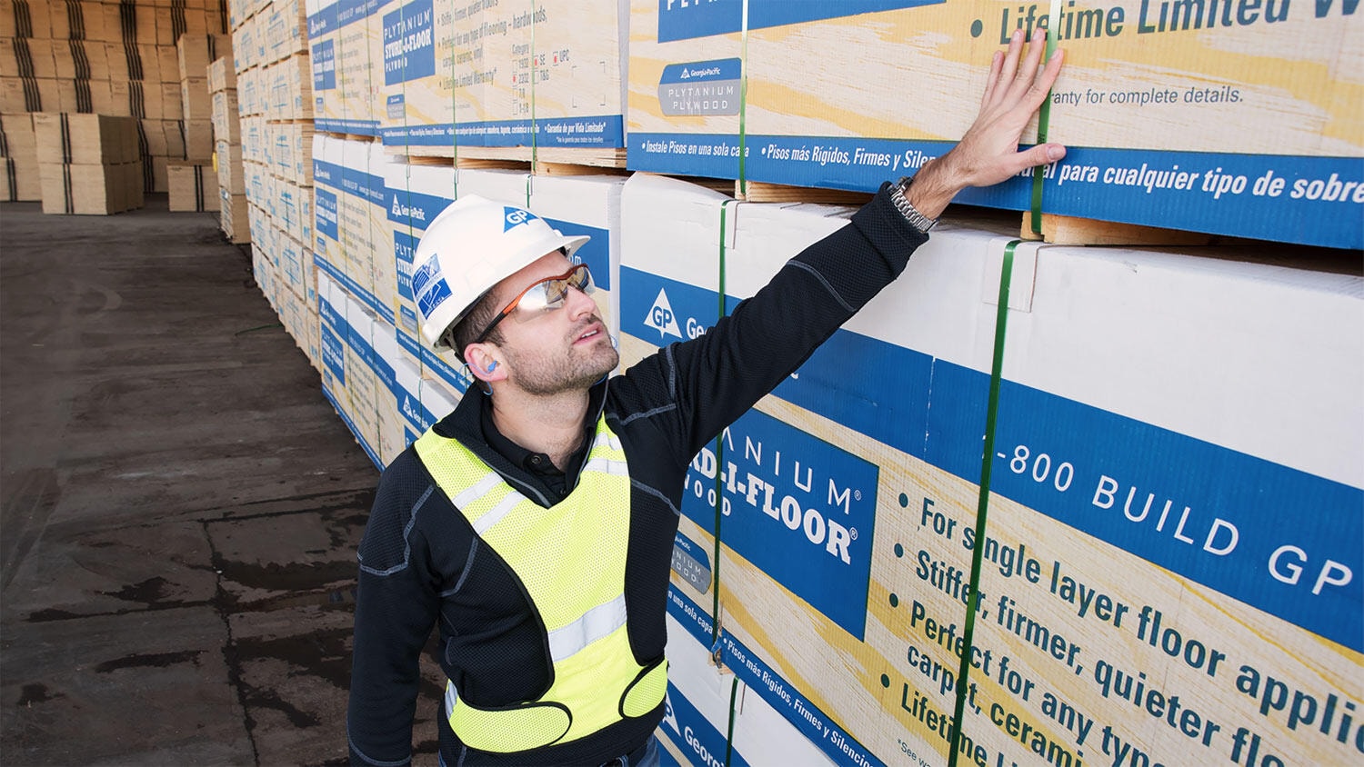 Georgia-Pacific worker inspects playwood