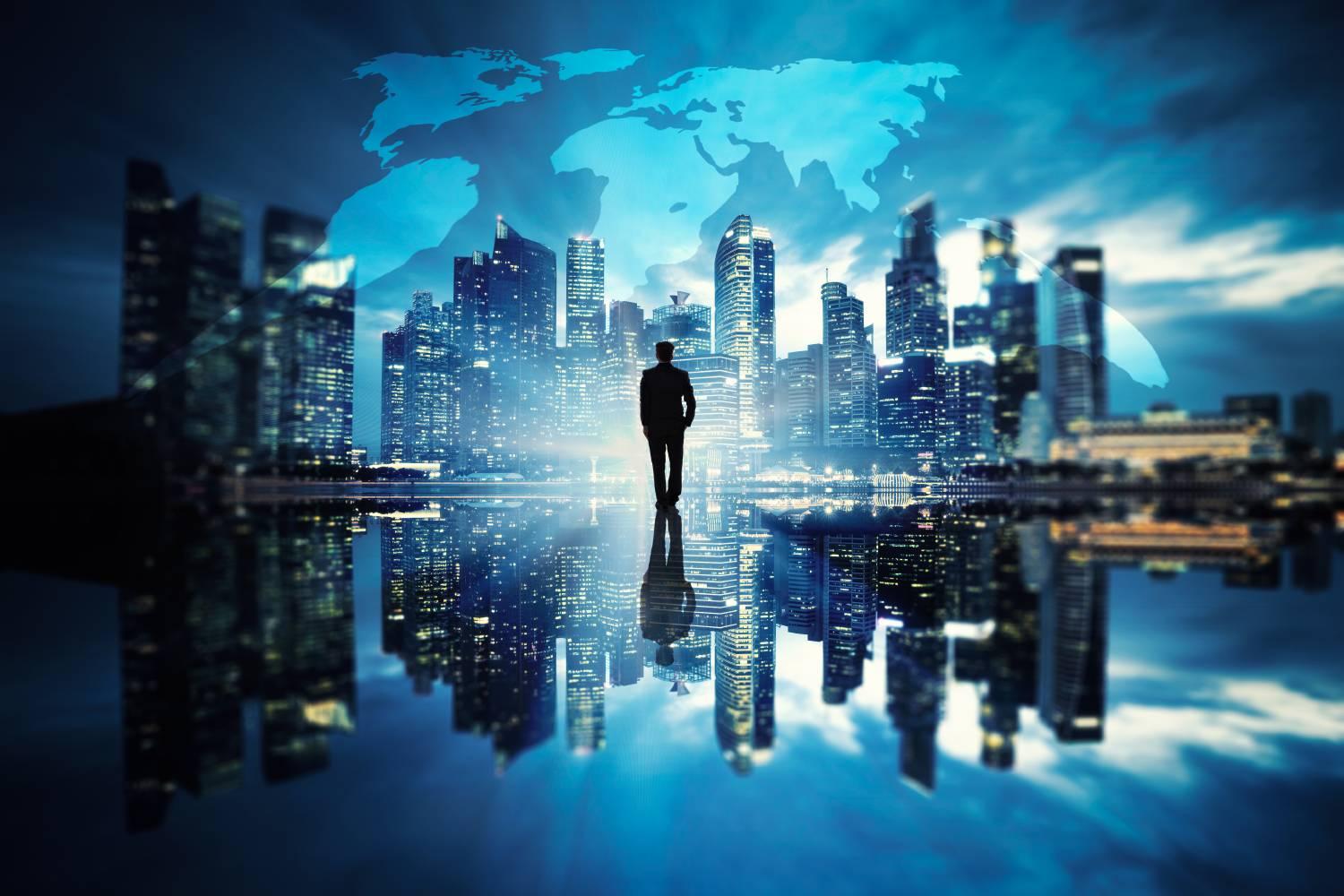 Man standing facing a futuristic Singapore skyline and global world map